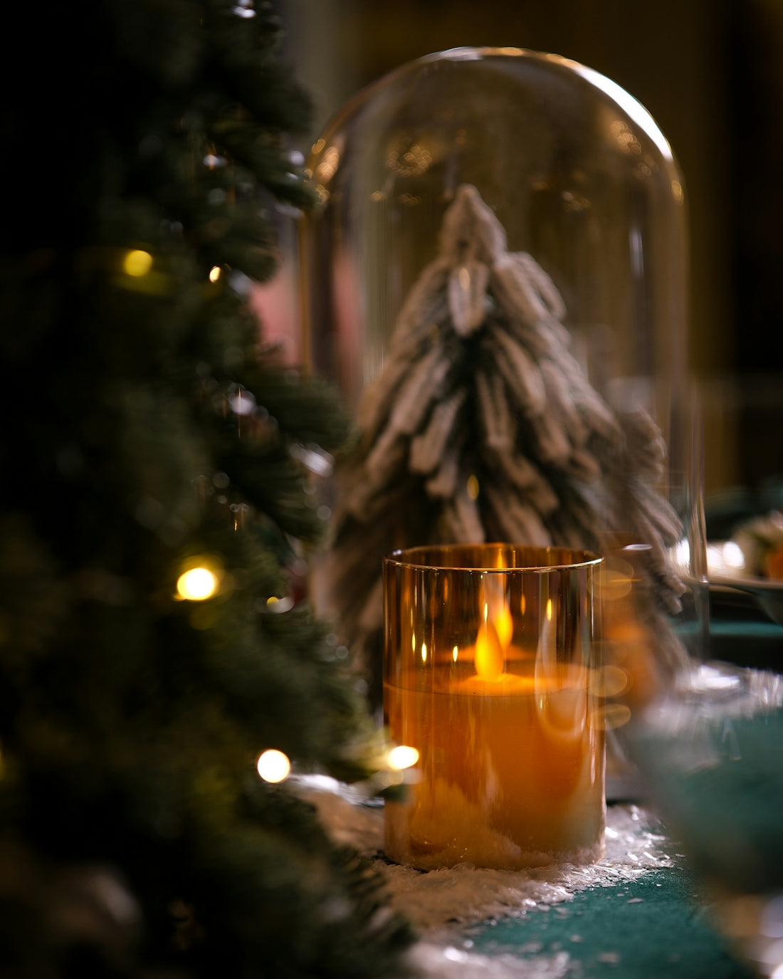 A lit candle sitting on top of a table
